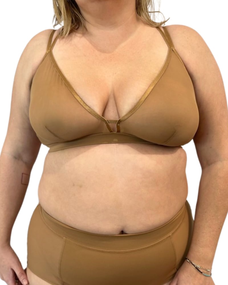 Front of a model wearing a size Large Nude Shade Mesh Racerback Bra in Mocha by Naked Rebellion. | dia_product_style_image_id:327956